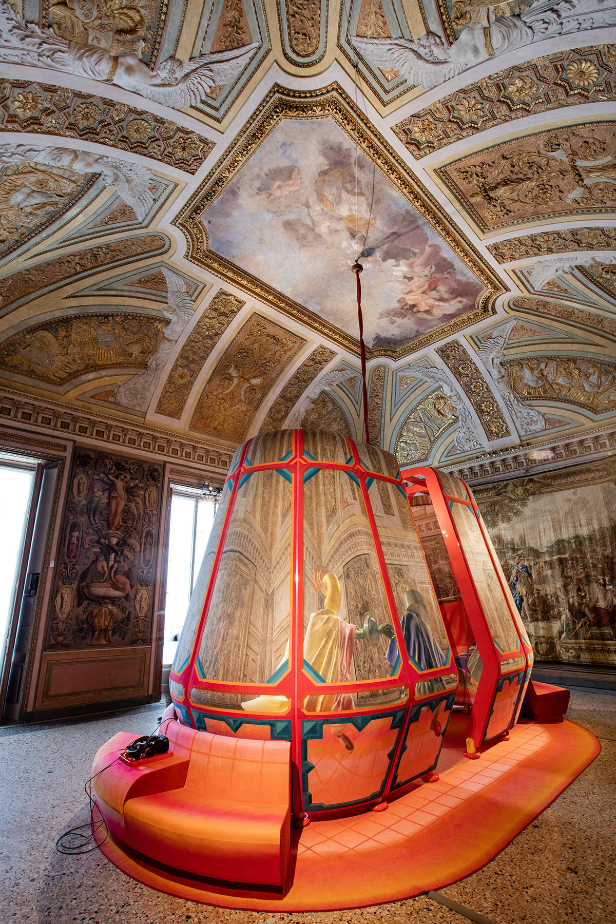 Image of colorful tubular installation in an ornate Italian government building