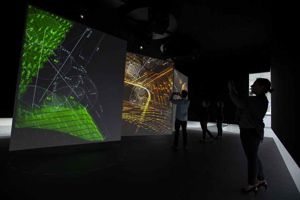 Image of viewers inside interactive digital installation