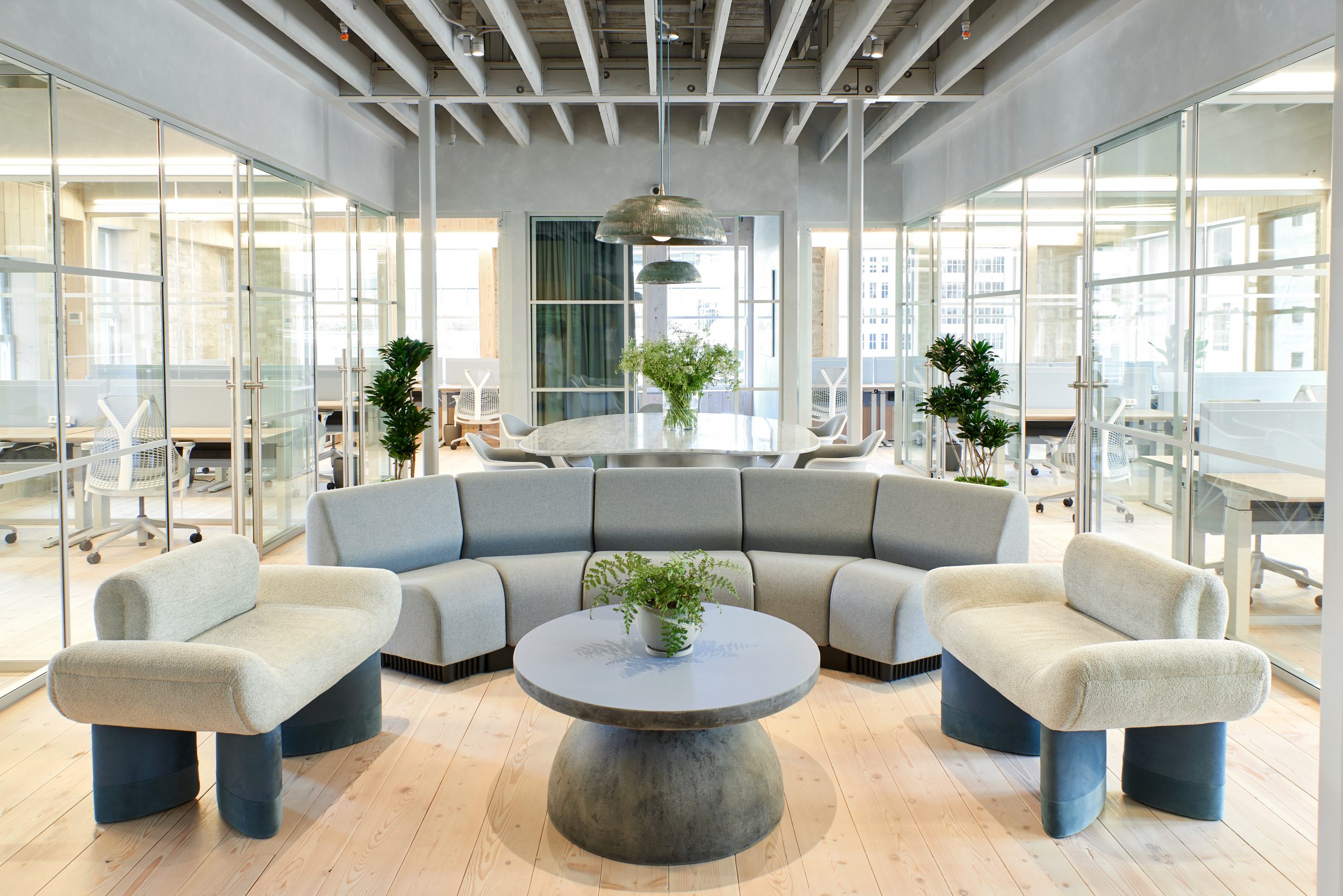 Communal spaces feature plush neutral-hued seating bathed in natural light. (Ben Kist)