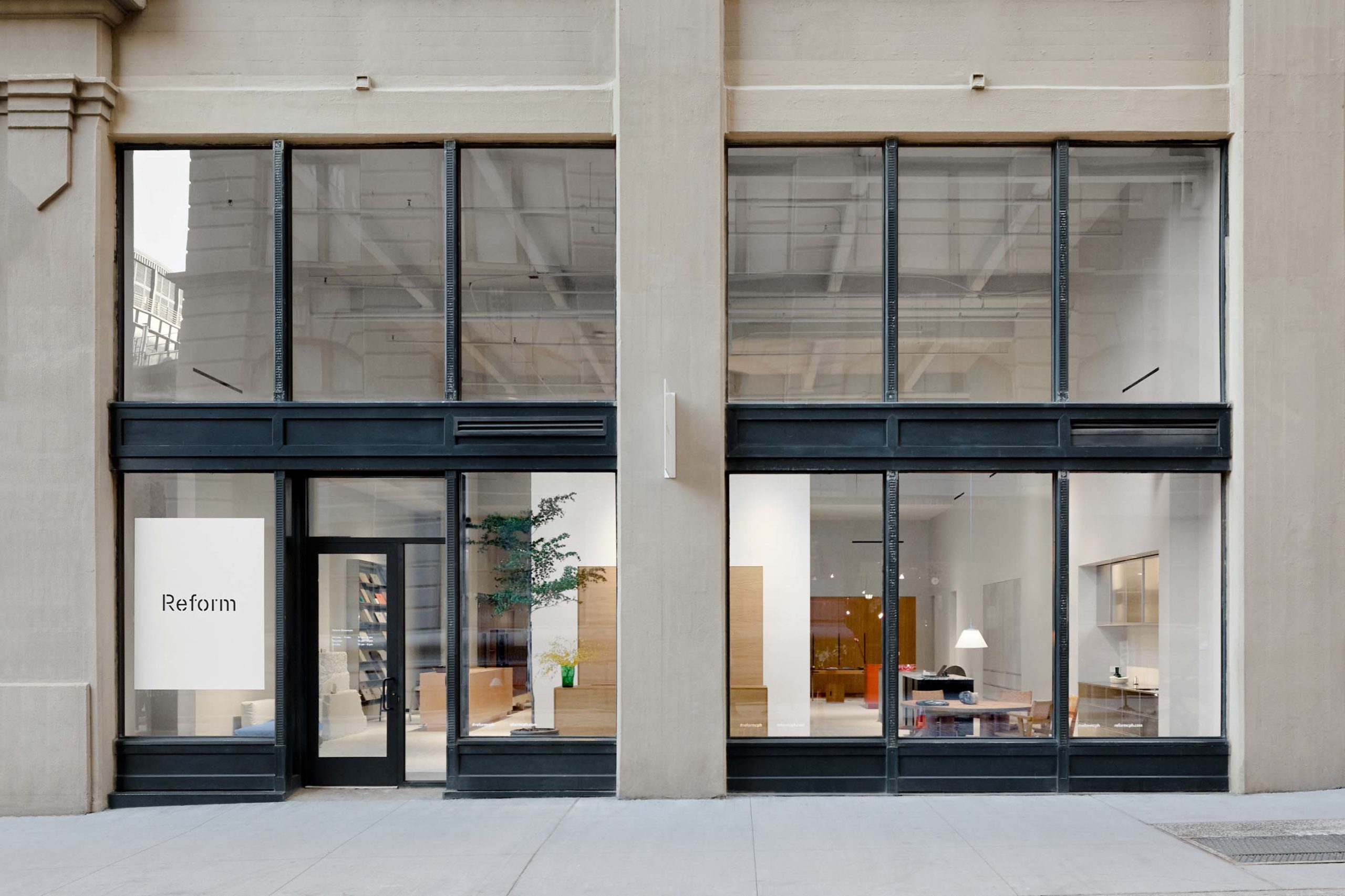 exterior of showroom with large windows with black framing