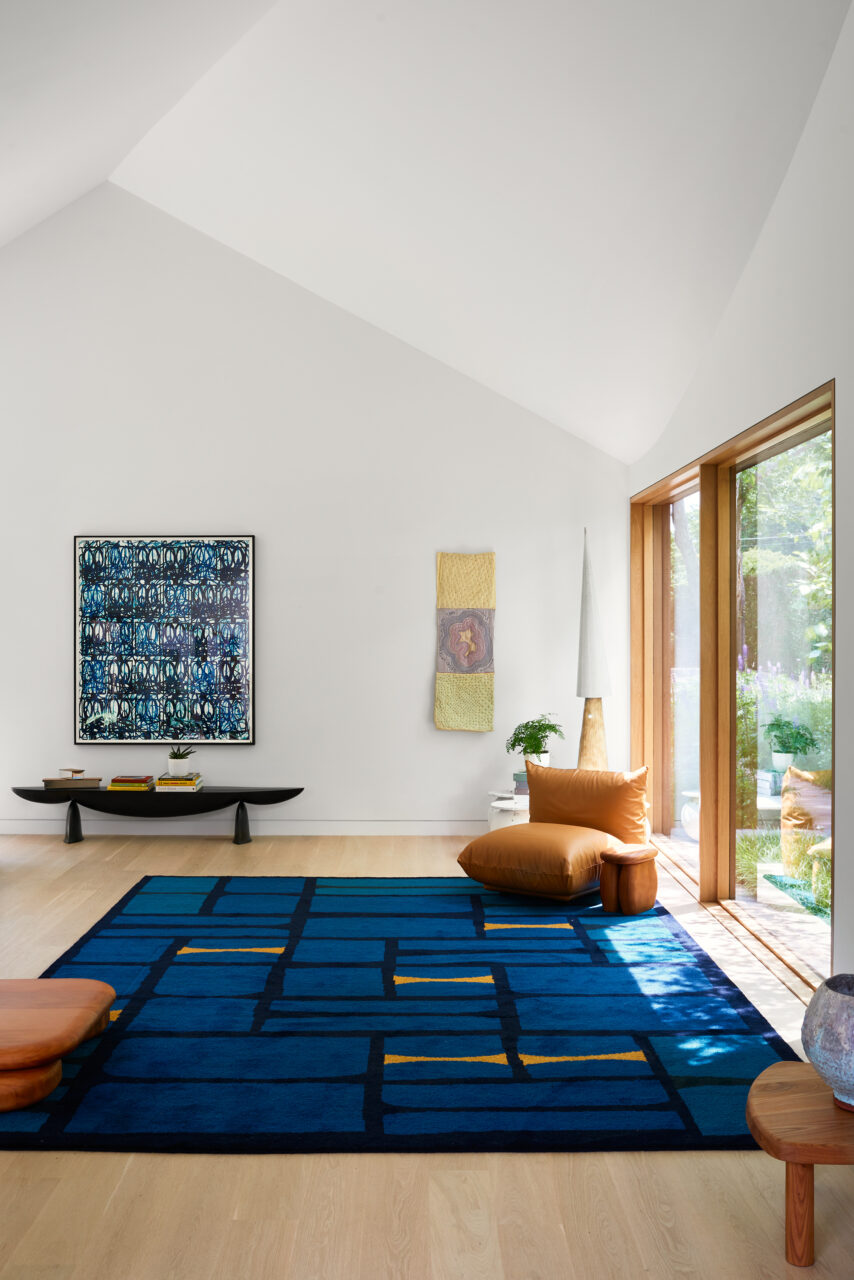 Blue artwork and textiles add pops of color to the showroom