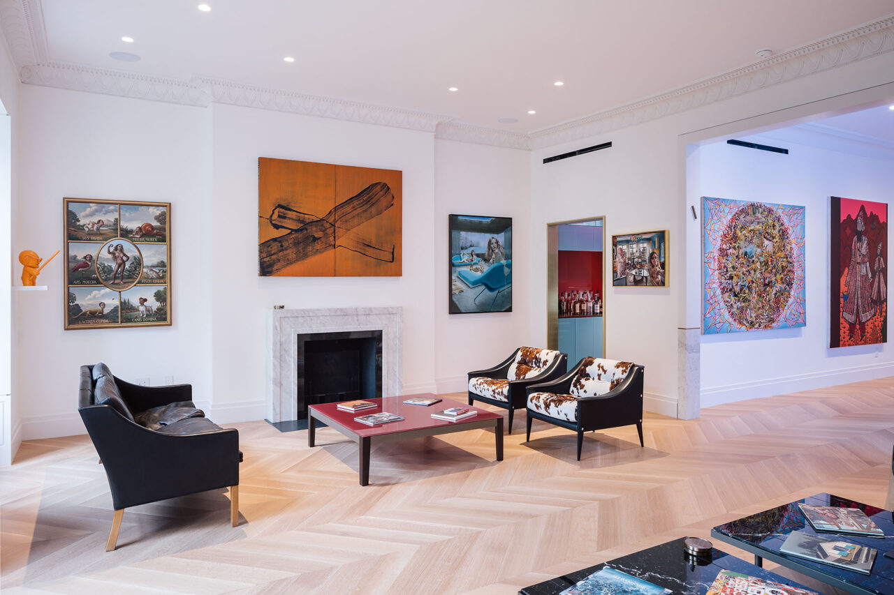 A living room apartment in New York City with vibrant artwork