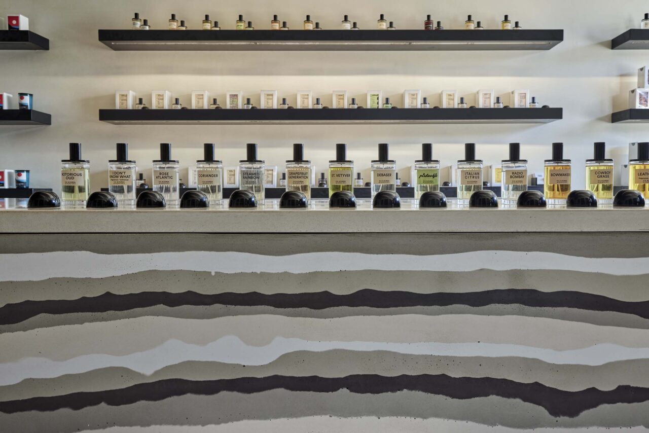 For perfume store's display, a striated design was used by pouring concrete