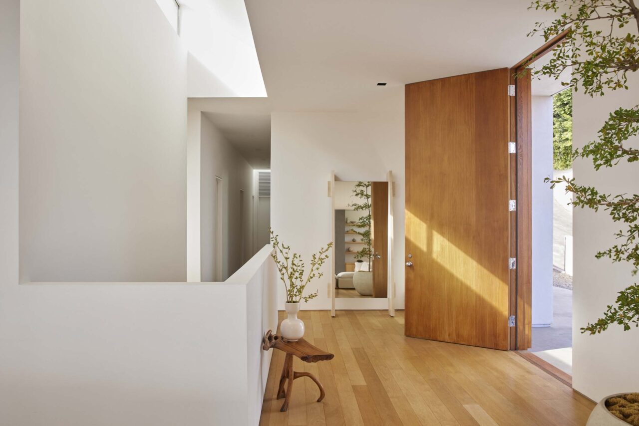 A rectangular lightwell creates clean lines in the hallway of a home