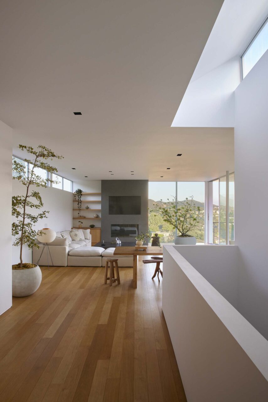 Clerestory windows and a center staircase let light and structure to a home