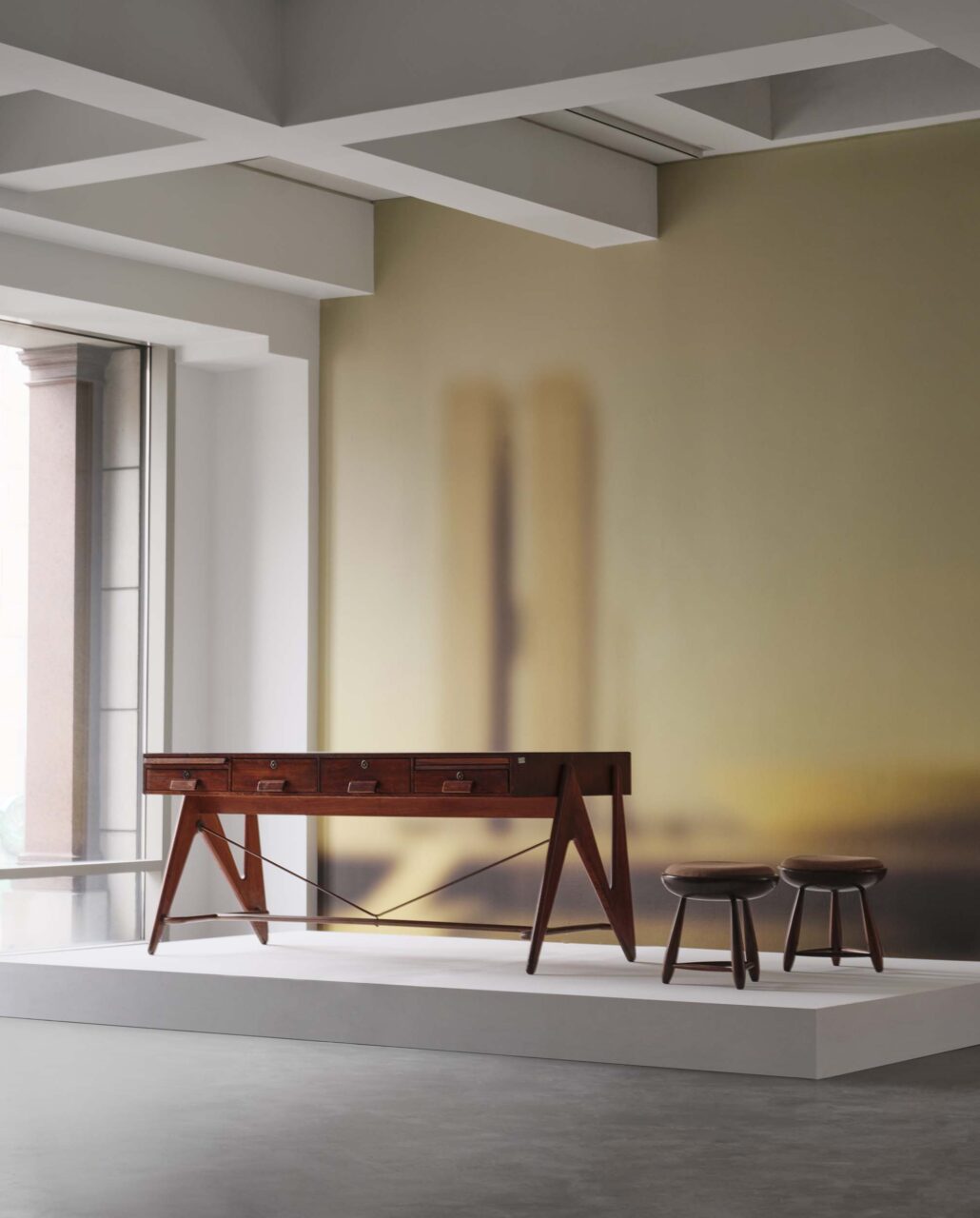 wood furniture on plinth in gallery