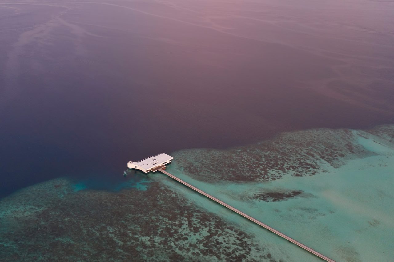 Photo of a long pier over the ocean