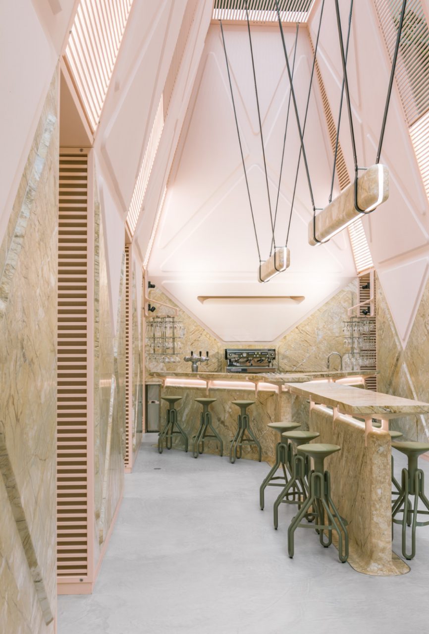 A cafe clad in pink stone