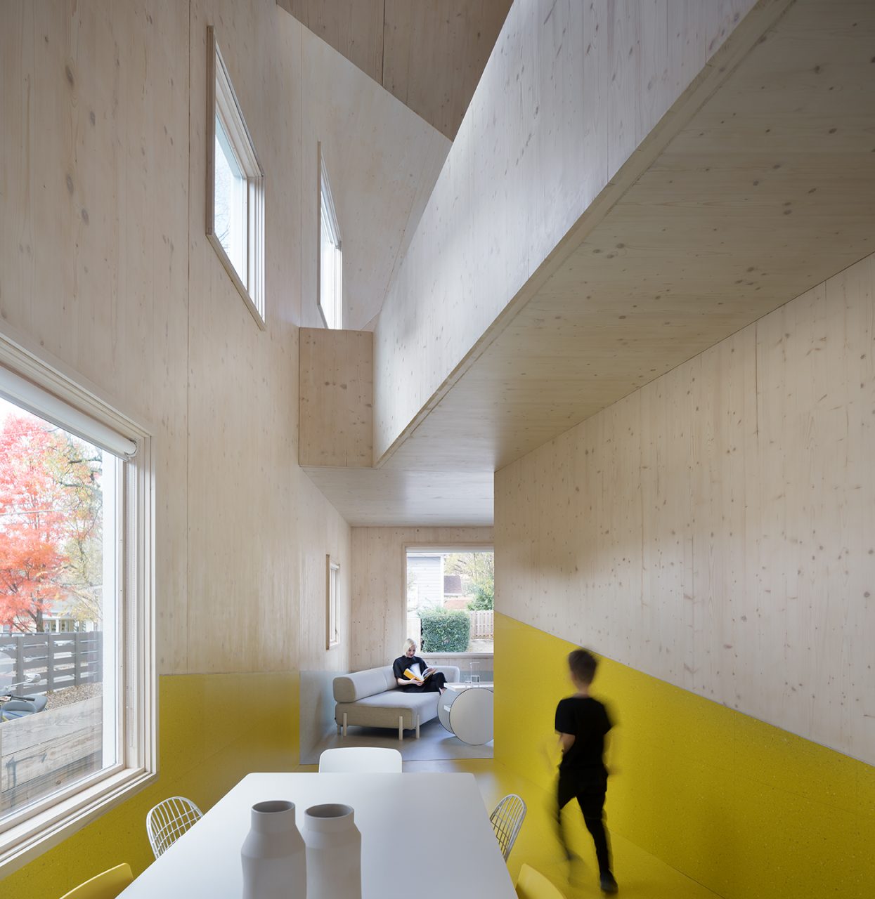 Image of Haus Gables interior with CLT exposed walls and yellow paint