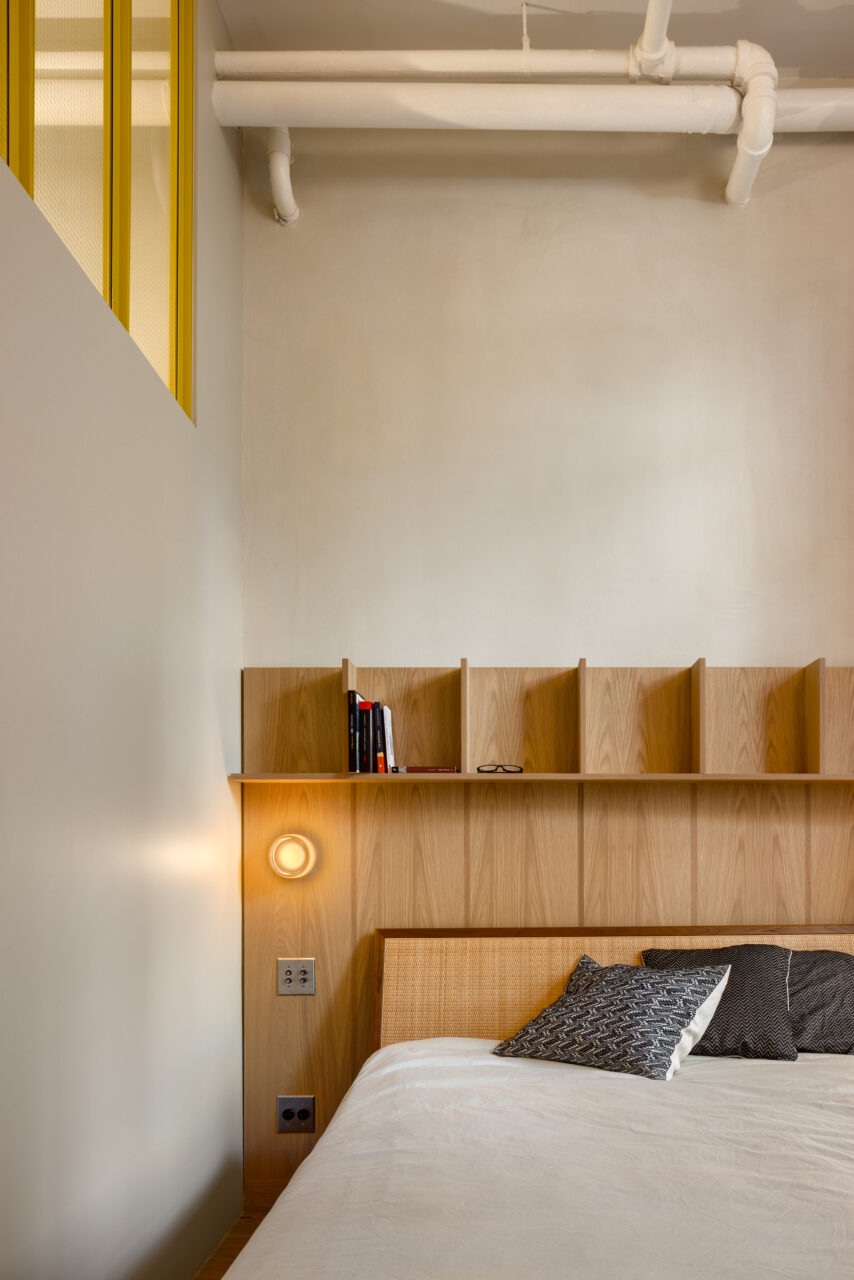 view of the bedroom with wooden headboard