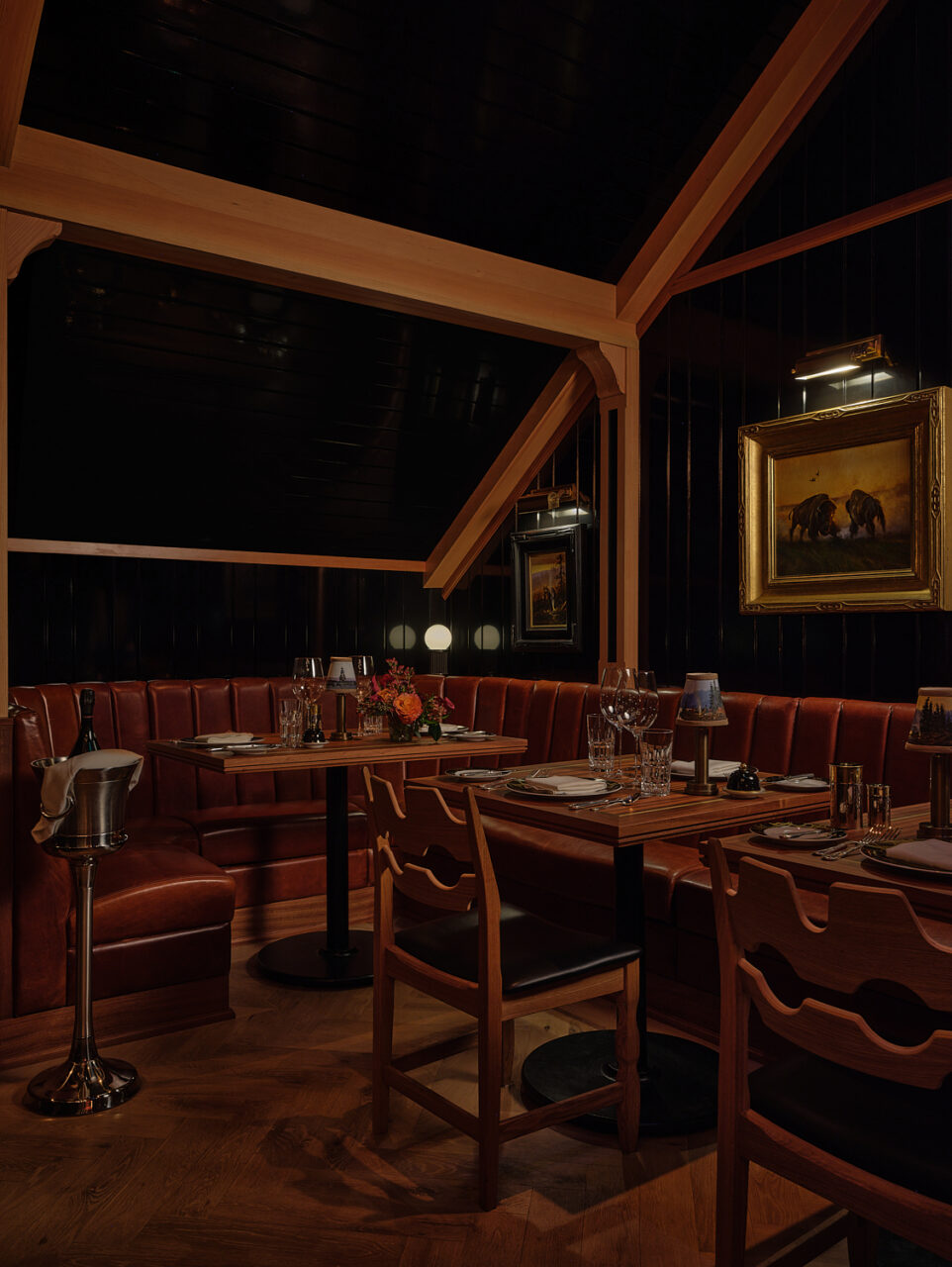 Auric Room features dark, paneled walls with an A-frame roof