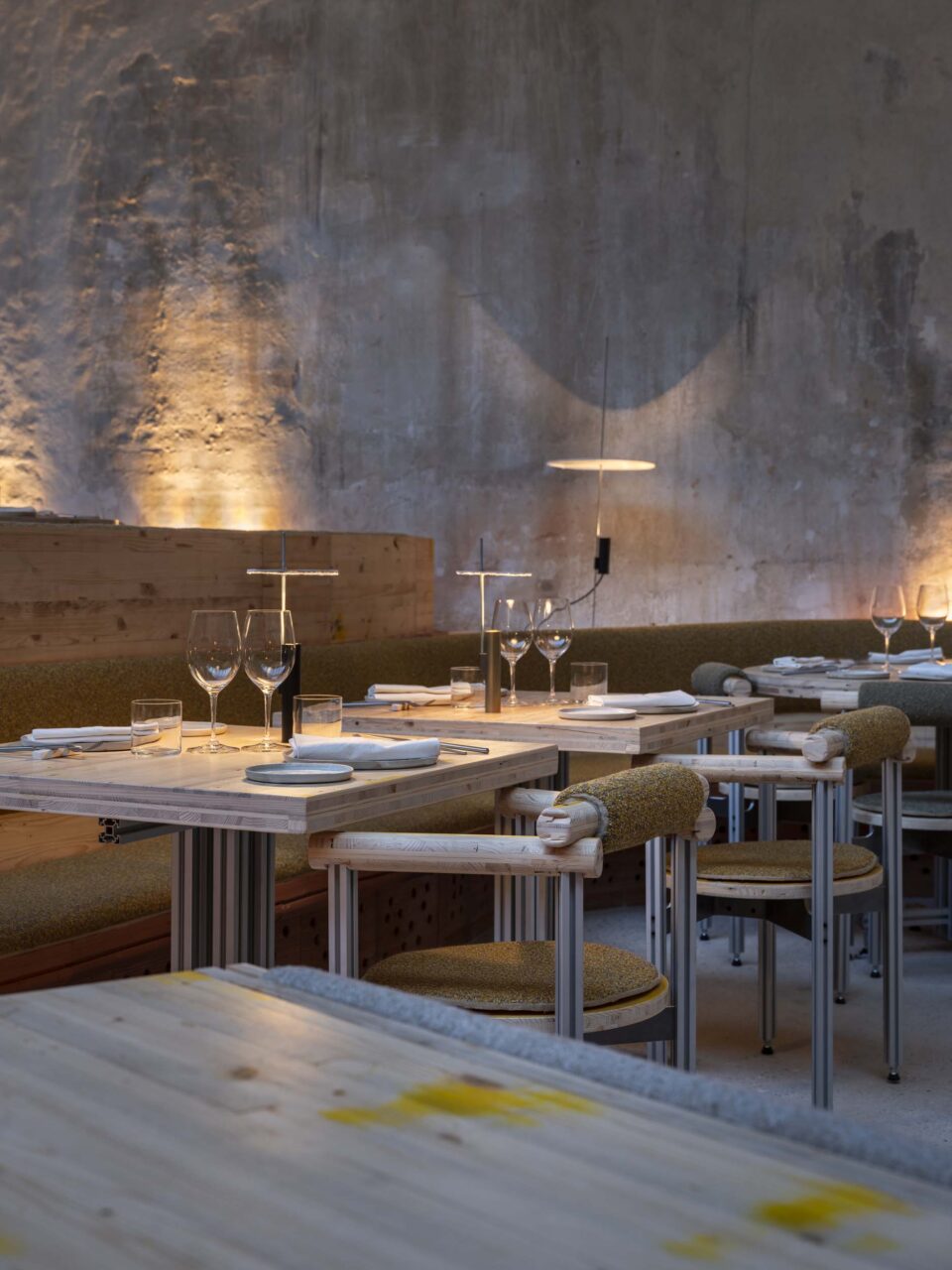 Tables at restaurant TRAMO are lit with solar, slim lamps