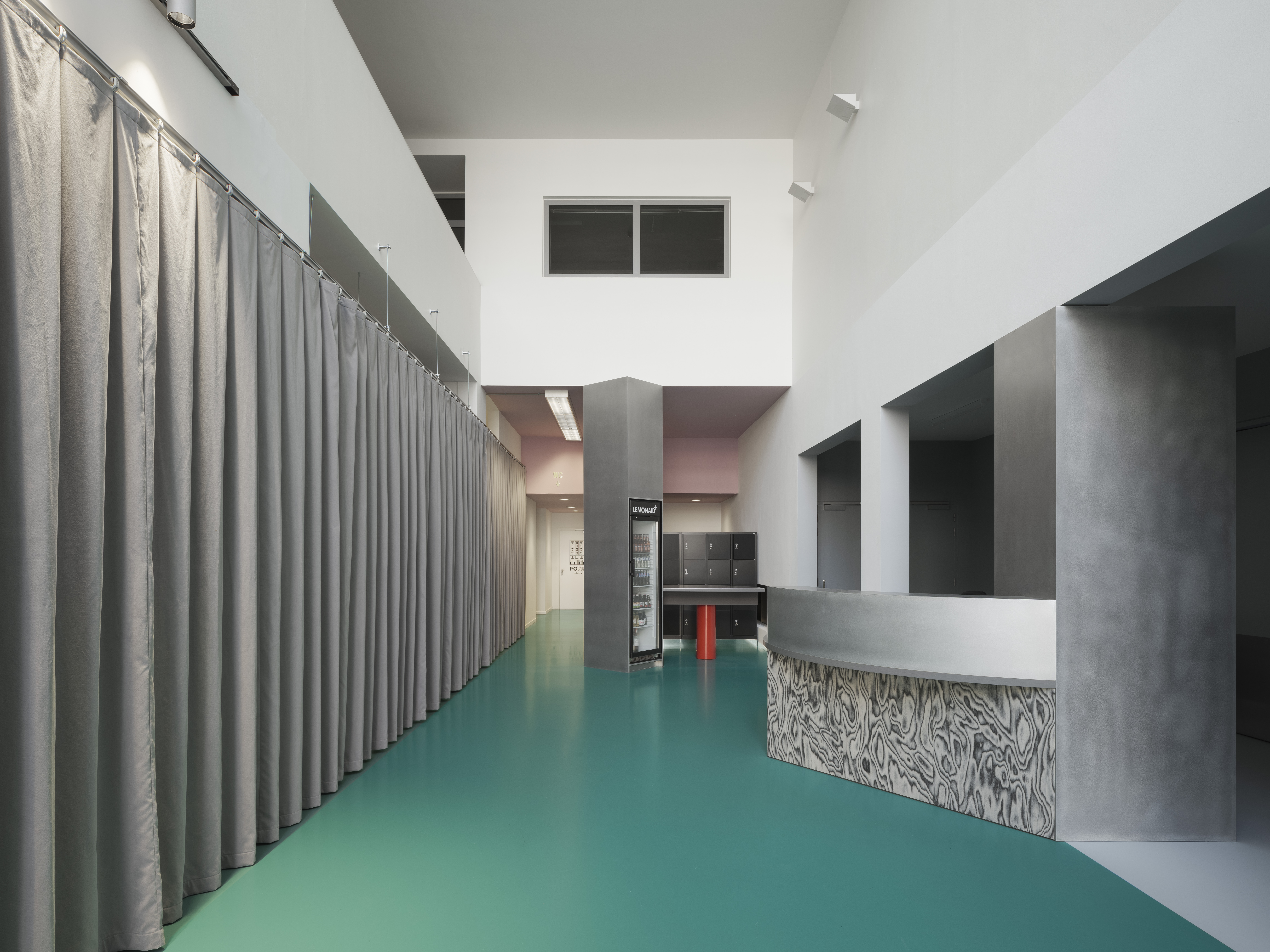 A teal floor greets visitors to the refreshed FOMU museum entrace