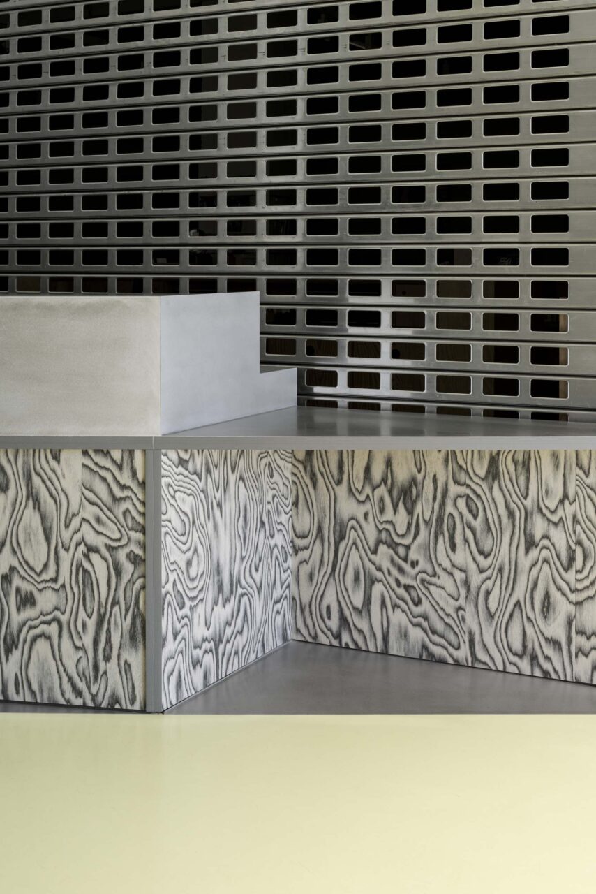 A steel table with creative staining reveals the wood grains at FOMU