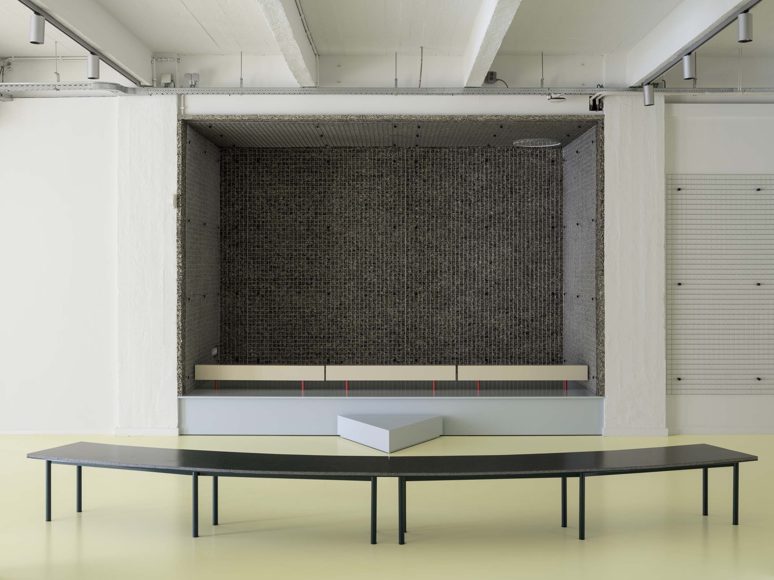 A small stage set behind yellow flooring was designed by i.s.m.architecten for FOMU