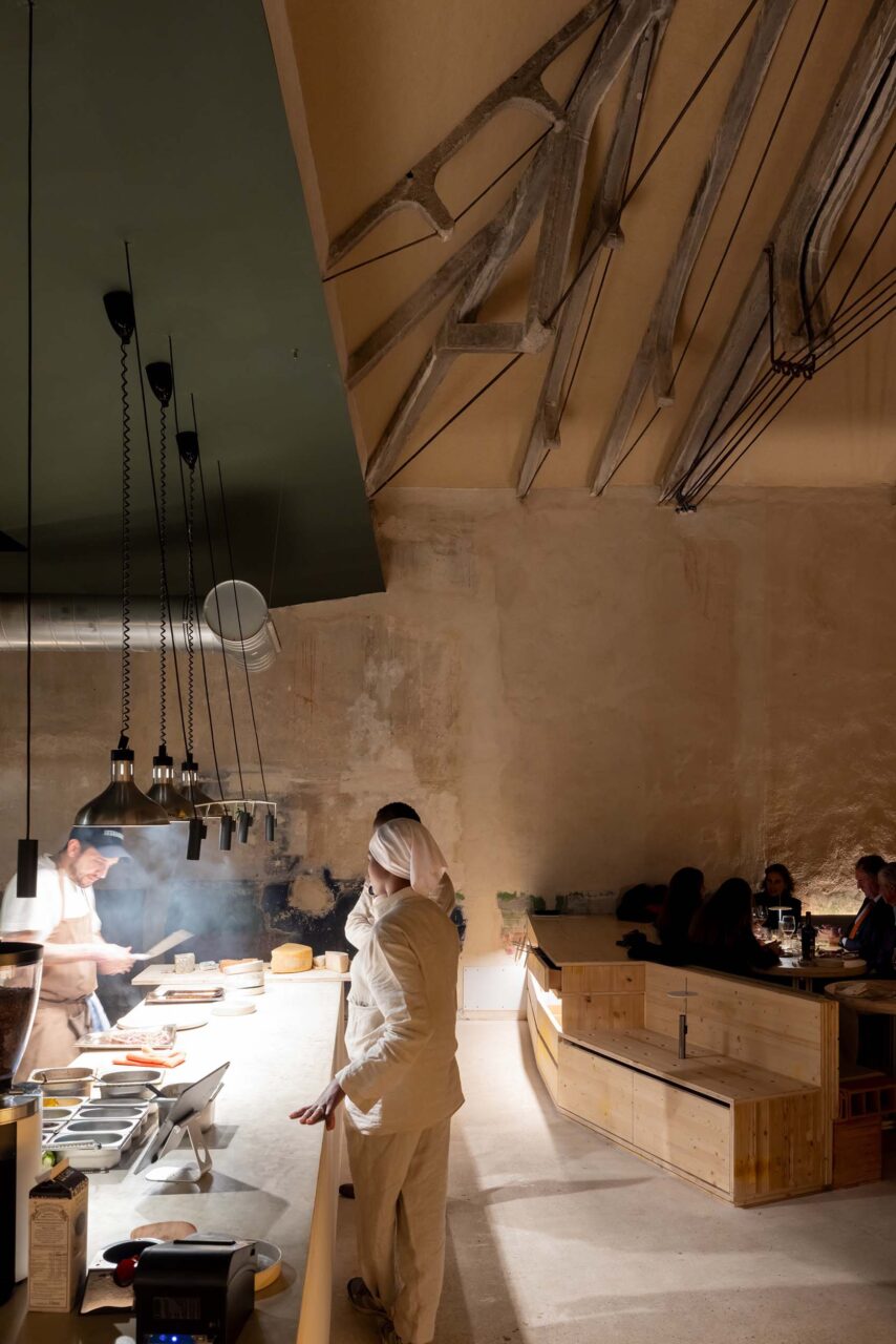 At night, TRAMO features guests that look onto the open kitchen where food is being prepared