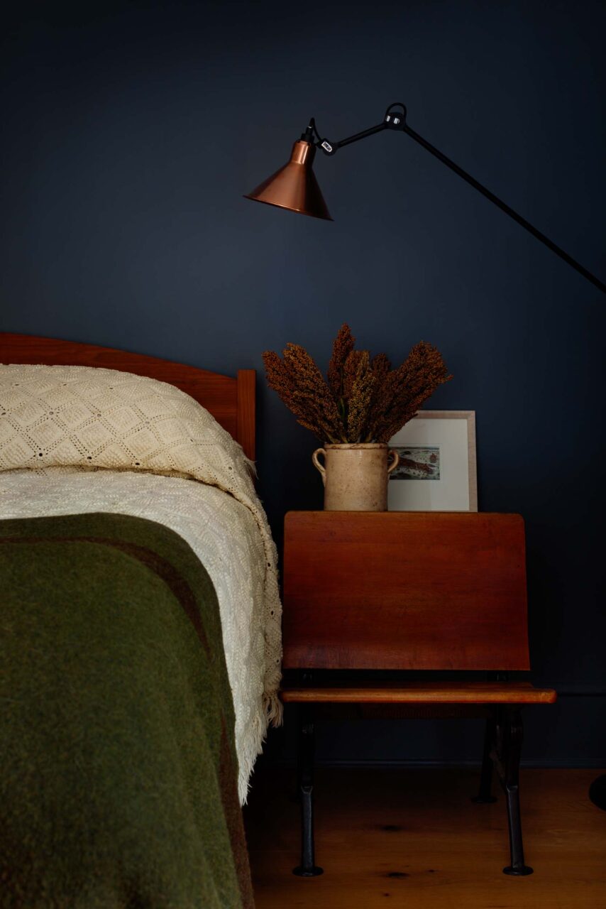 An indigo wall and green bed at Cleveland Park House