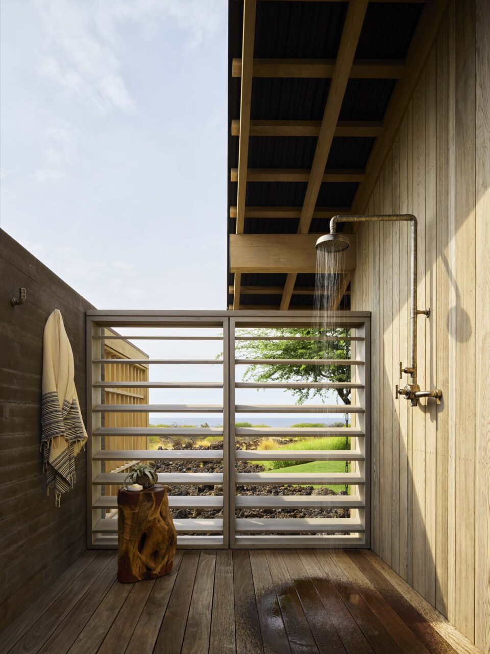 An outdoor shower looks out to the Kona Coast at Hale Kiawe