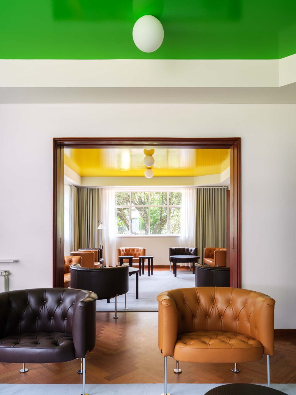 One green-ceiling room gives way to a room with a yellow ceiling at the Swiss embassy