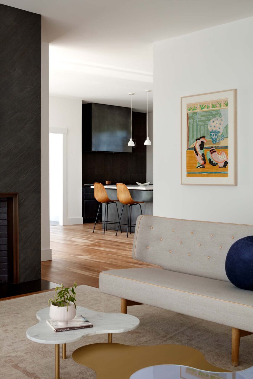 A look through a living room to the metallic kitchen in Wye River, Maryland