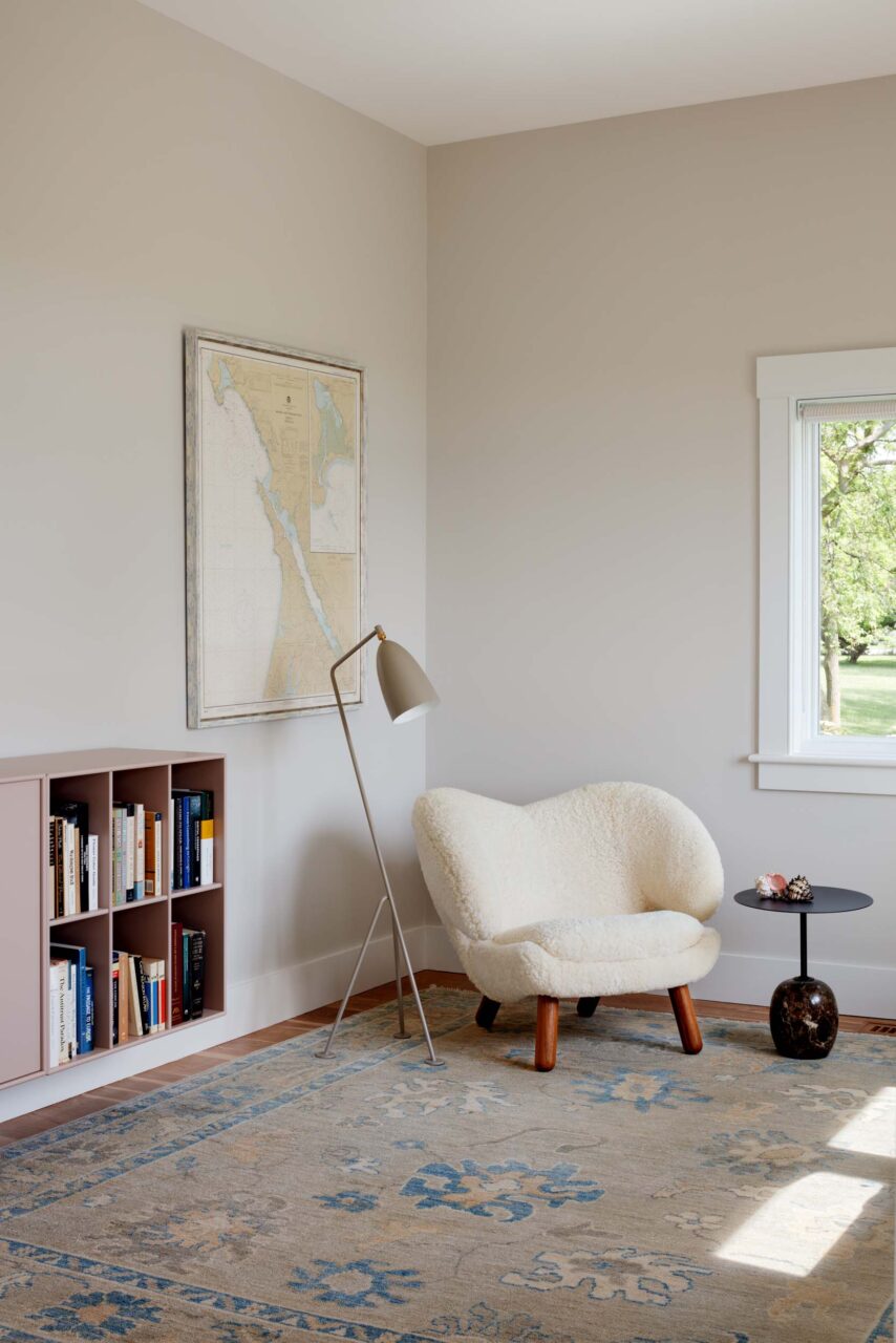 A bedroom corner with a shearling lounger from Hendricks Interiors