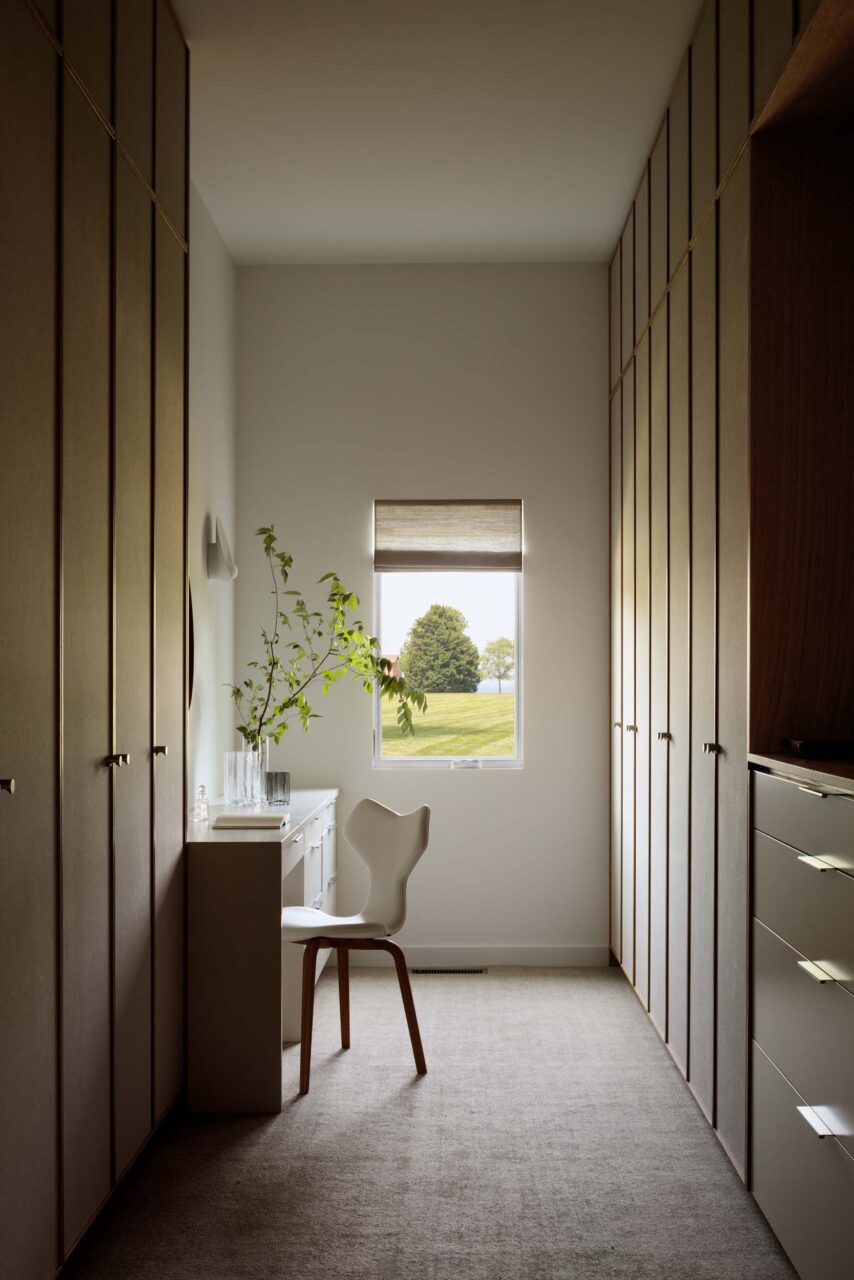 A dressing room with a window at the end by Colleen Healey