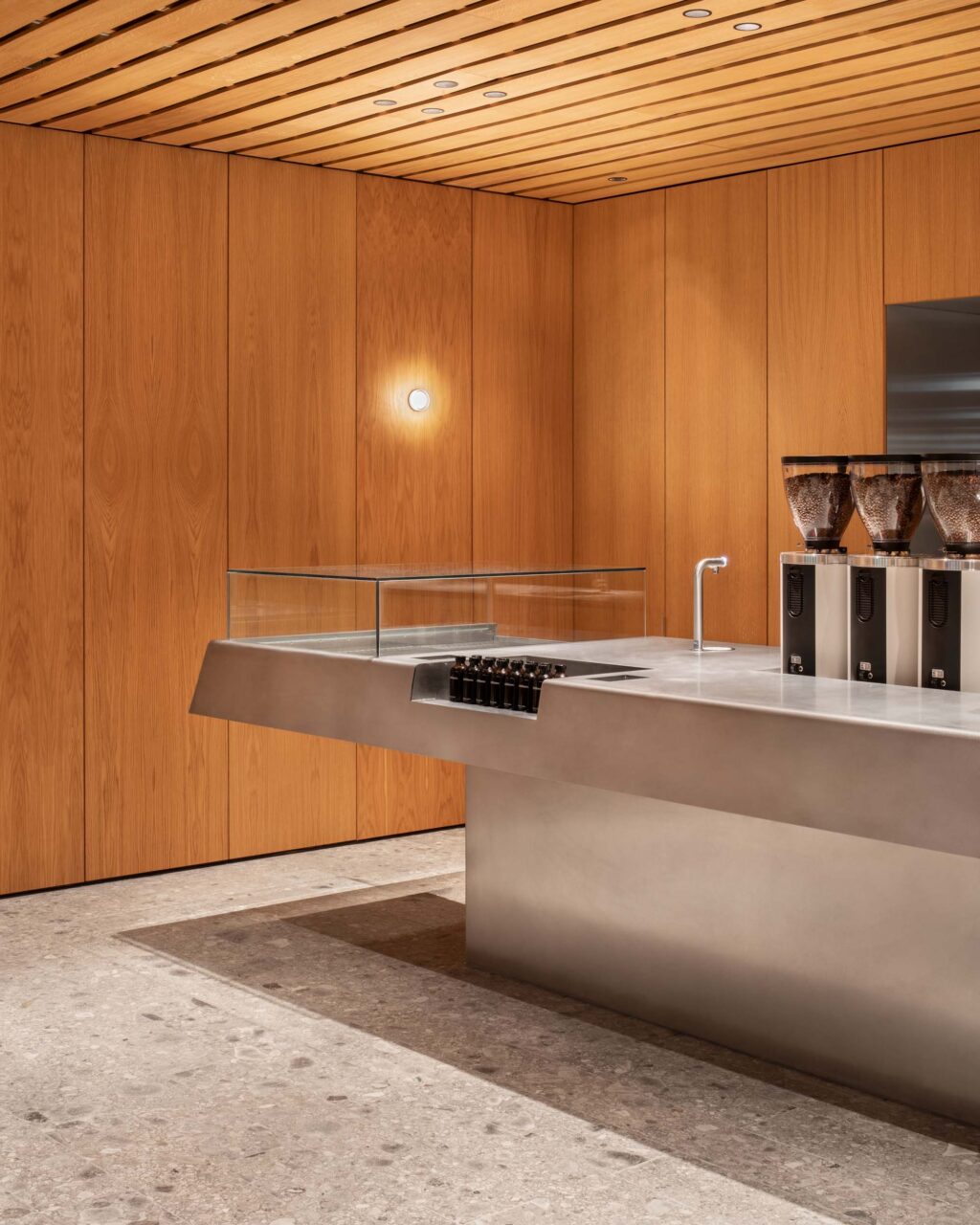 A sleek steel table designed by EBBA for coffee making