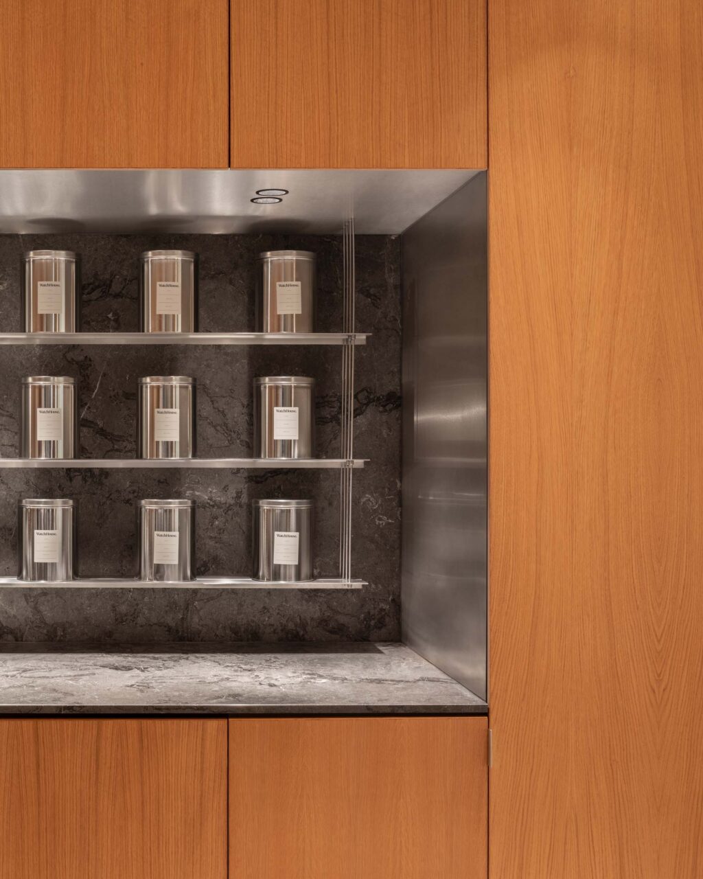A grid of coffee canisters at WatchHouse Atrium