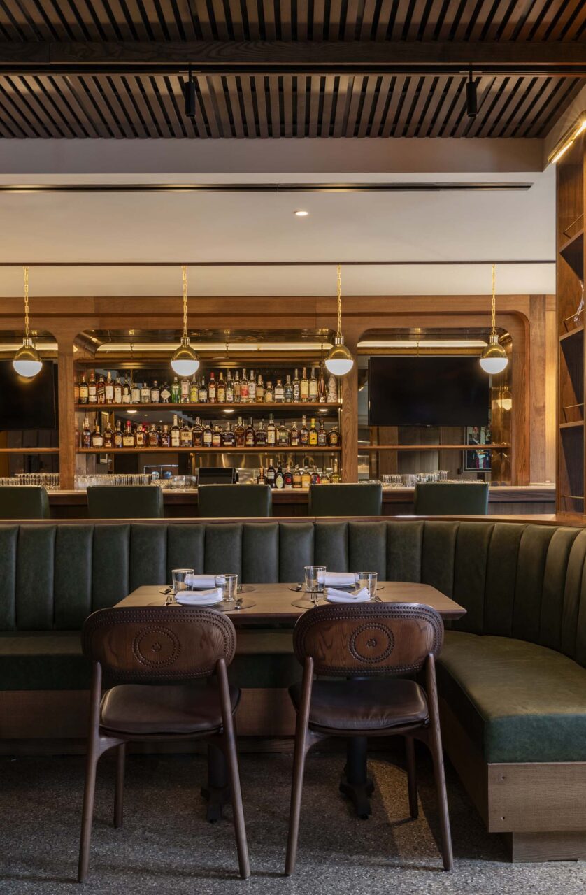 Hunter green banquettes are part of Gensler's design for Bar Bludorn