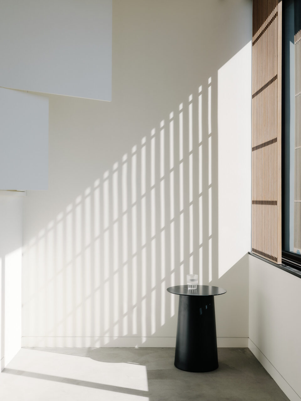 Light comes in from a window onto a residence by Min Design