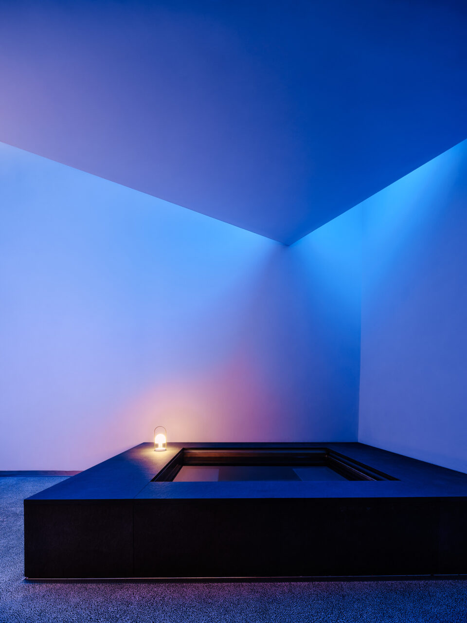 LED blue lights are cast around a rectilinear plane on the ceiling