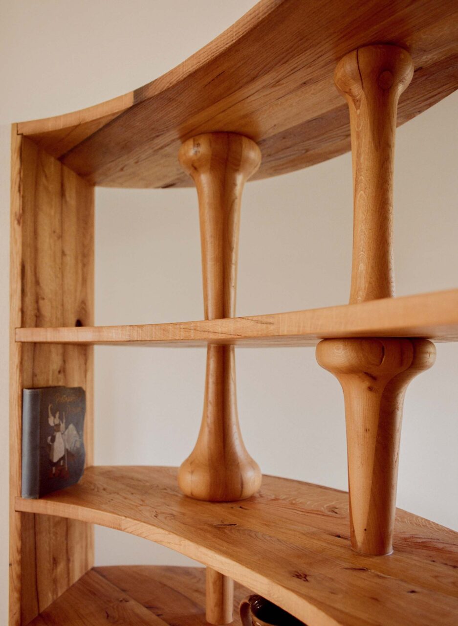 A close-up of a wooden shelf with sculptural elements for a 13th century castle