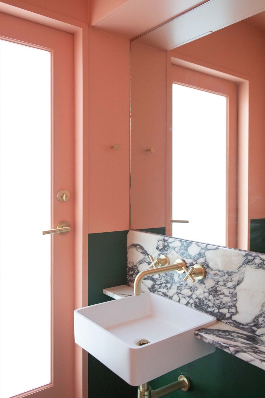 A green and pink bathroom by Loaf