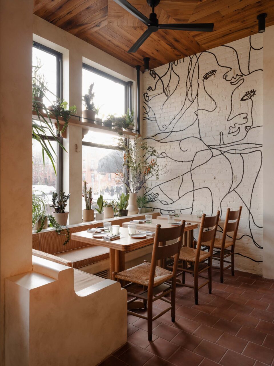 A line-drawing mural at a window seat of a Theodora