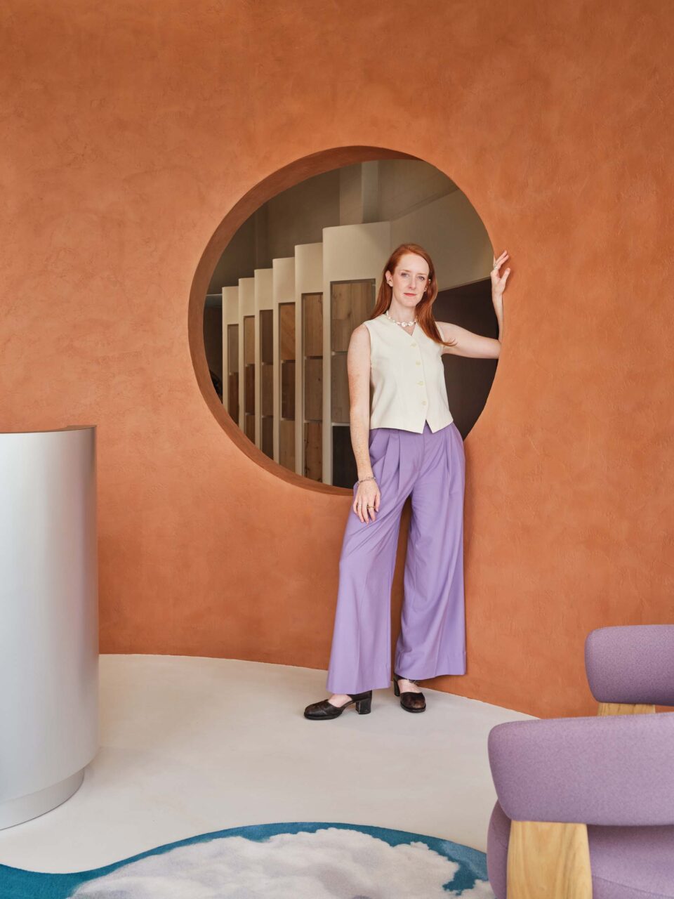 Madelynn Ringo in front of a orange wall