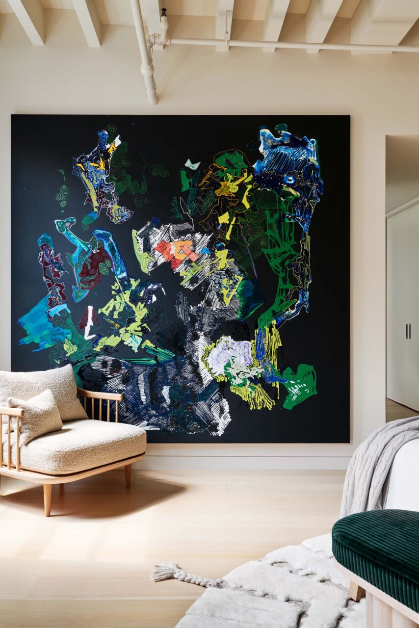 A bedroom with artwork curated by Colony Design