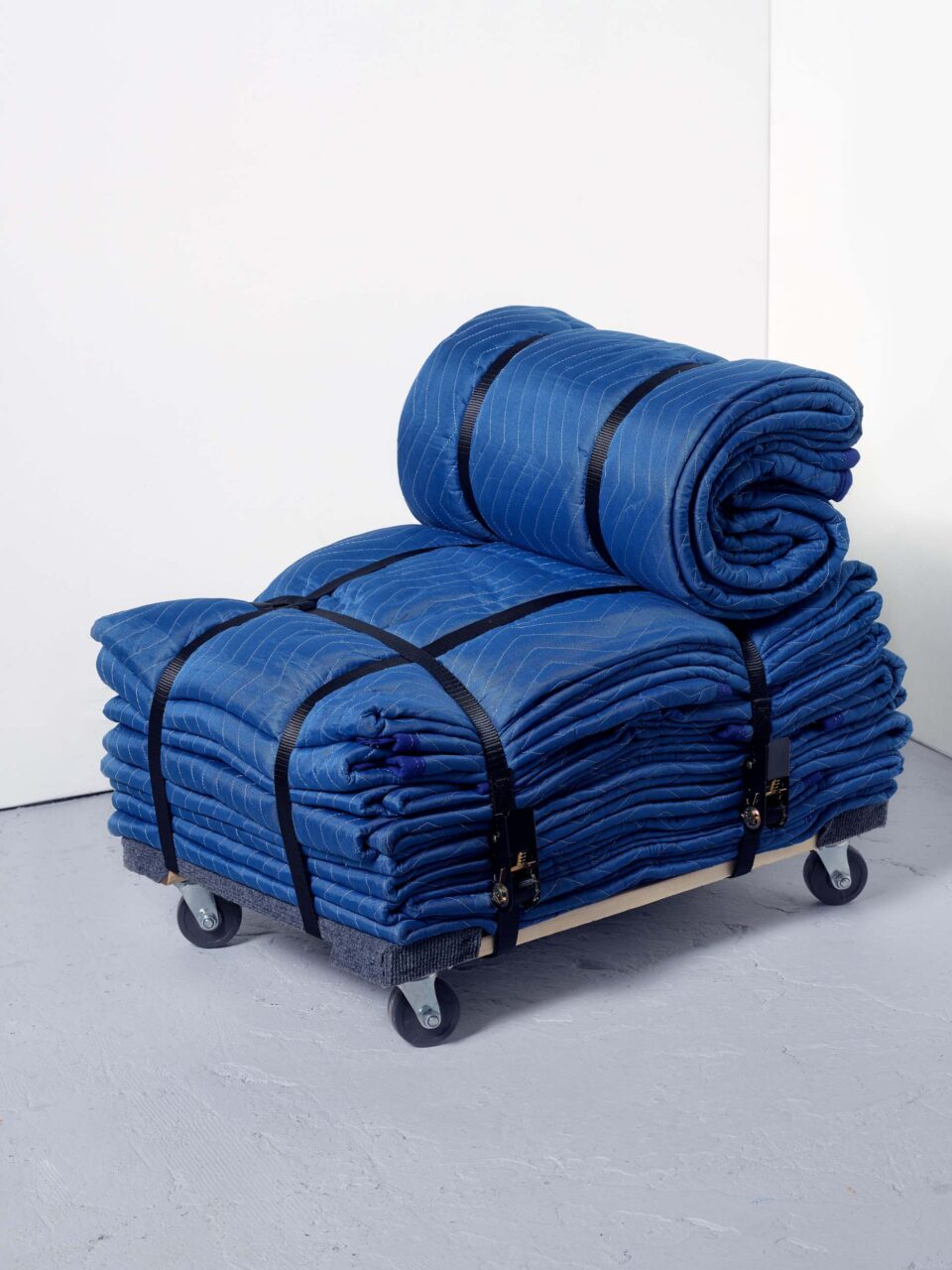 A blue chair made from blankets by Eliza Axelson-Chidsey