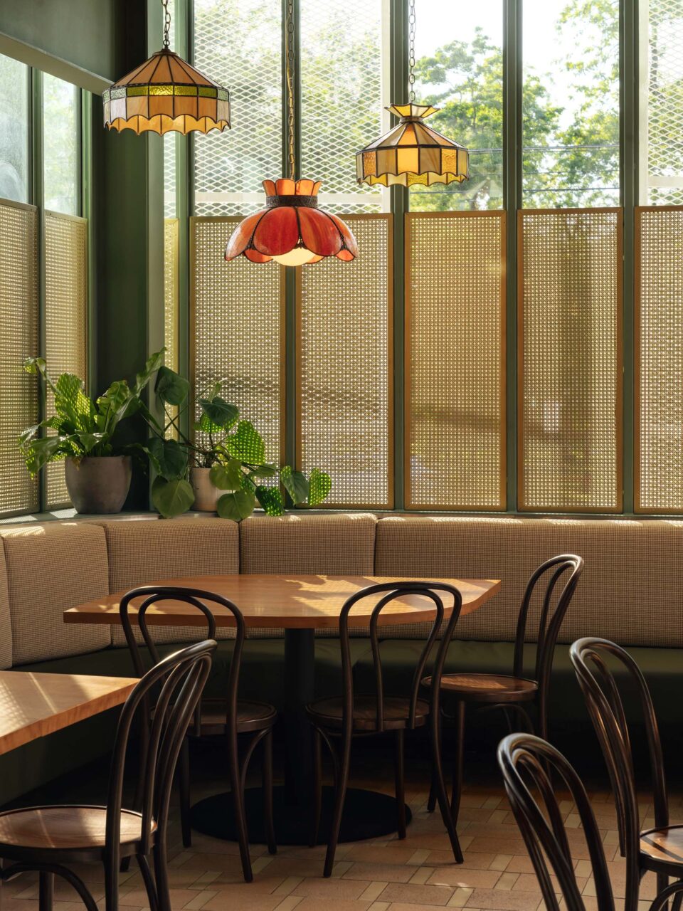 The booth seating at Bambino features stained glass pendants