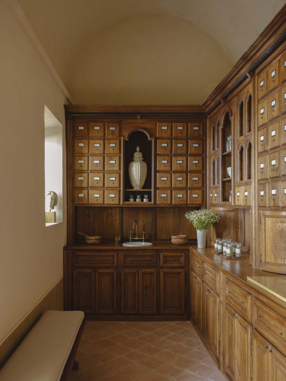A storage room with a barrel-vaulted ceiling, furnished by Festen