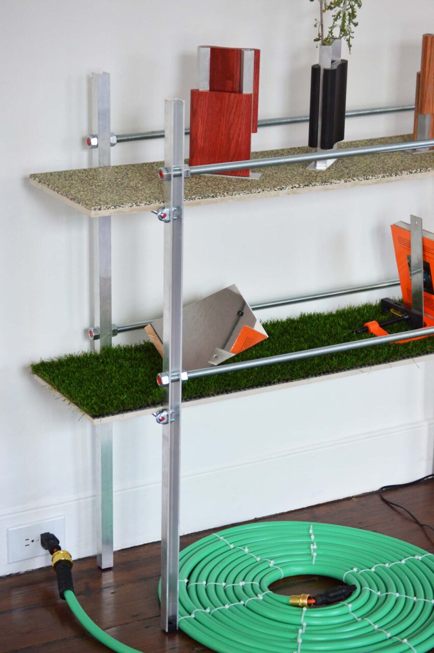 A floor shelf with a hose rug at Nuts and Bolts