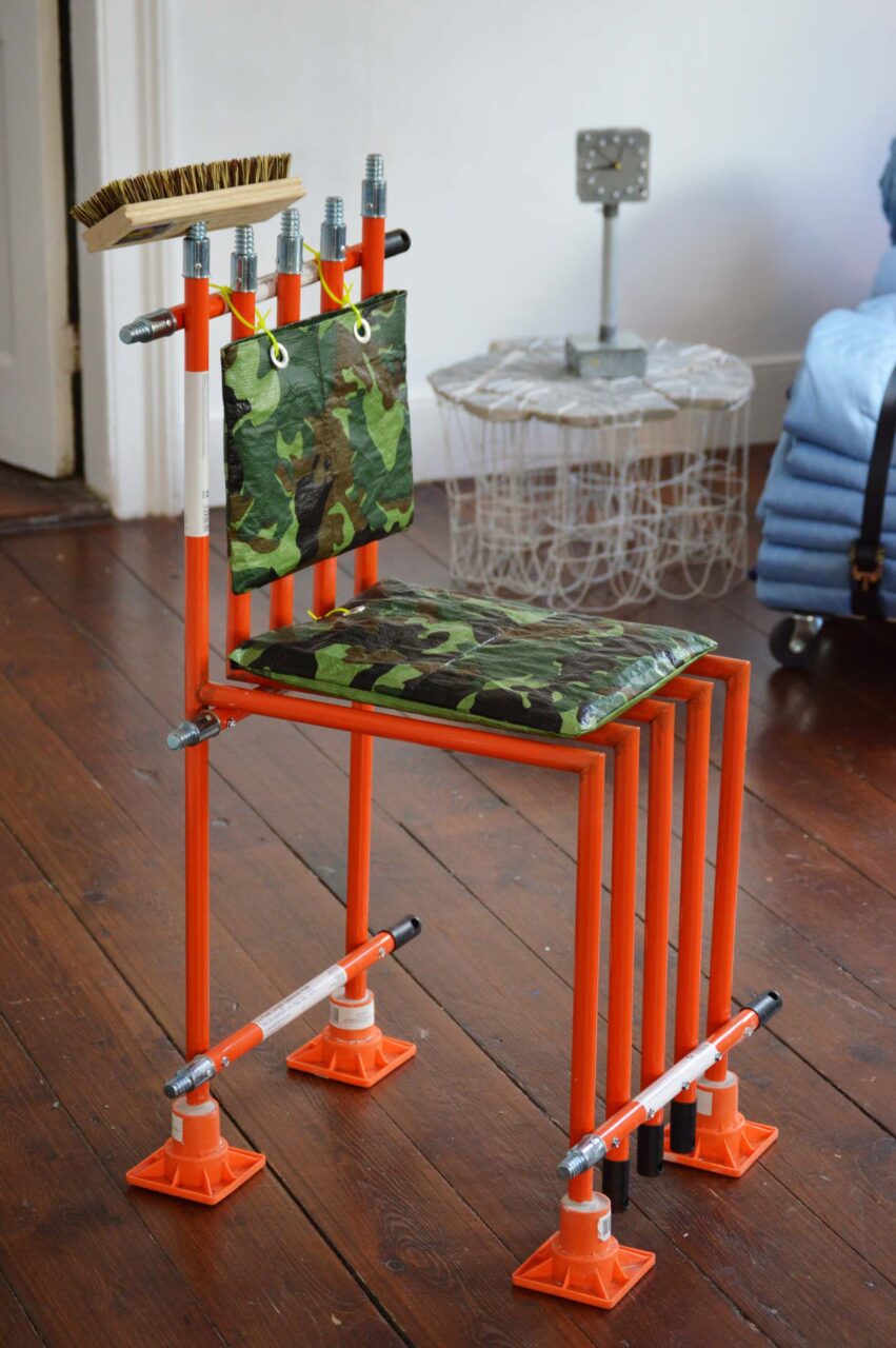 An orange dining chair at Nuts & Bolts exhibit
