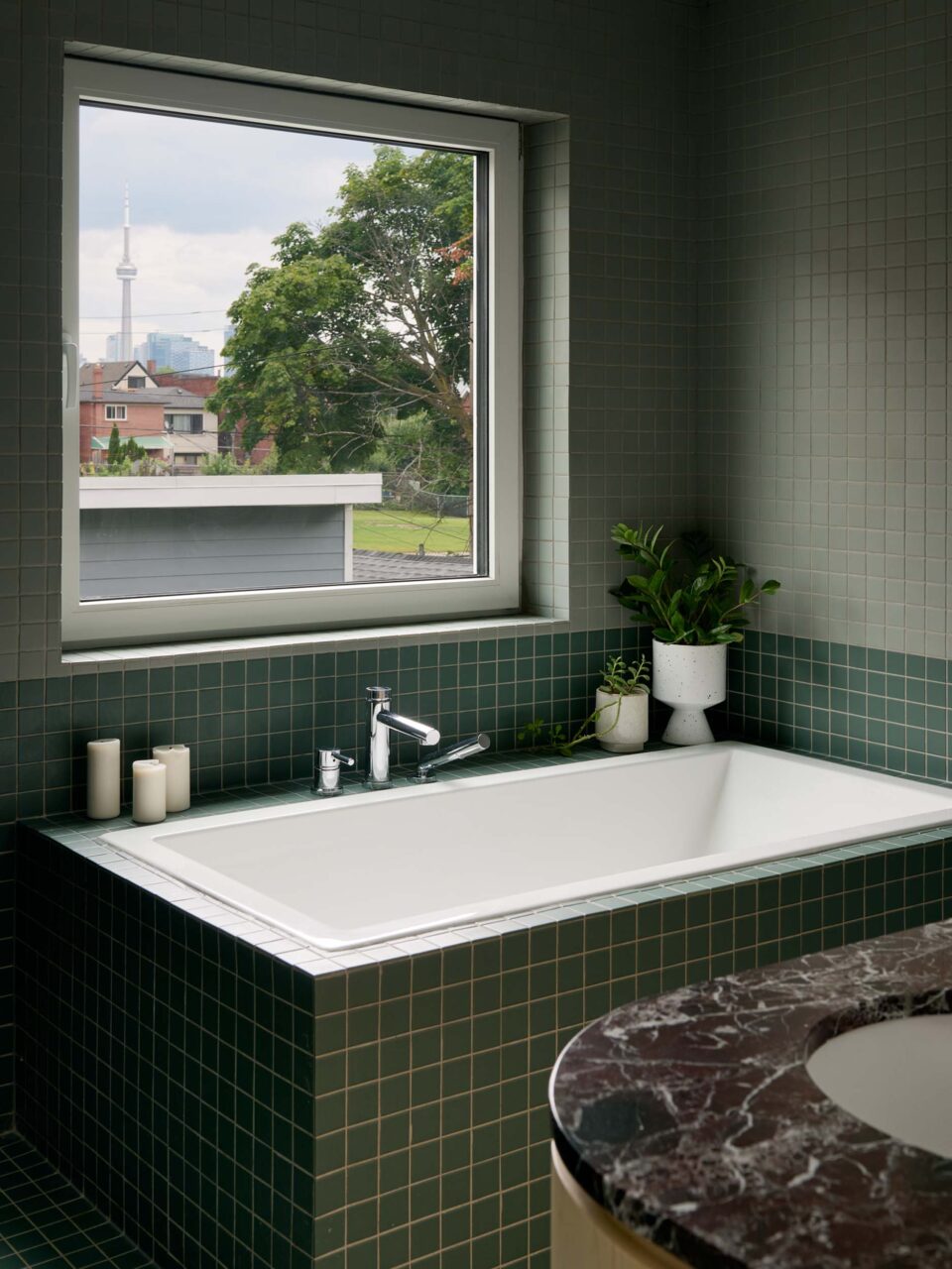 Sheeep studio design a green tiled bathroom