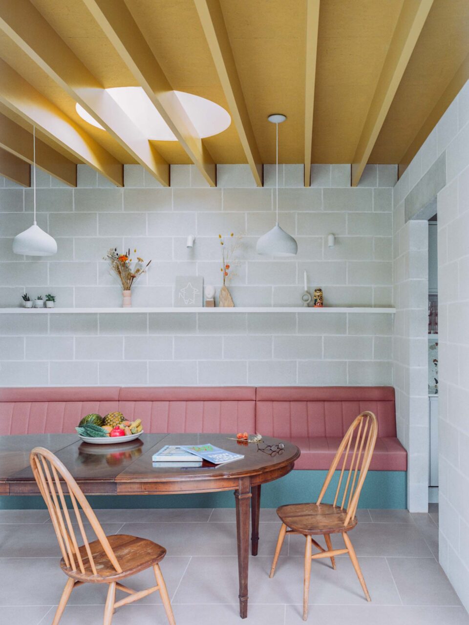 Colorful furnishings by Artefact studio in an addition