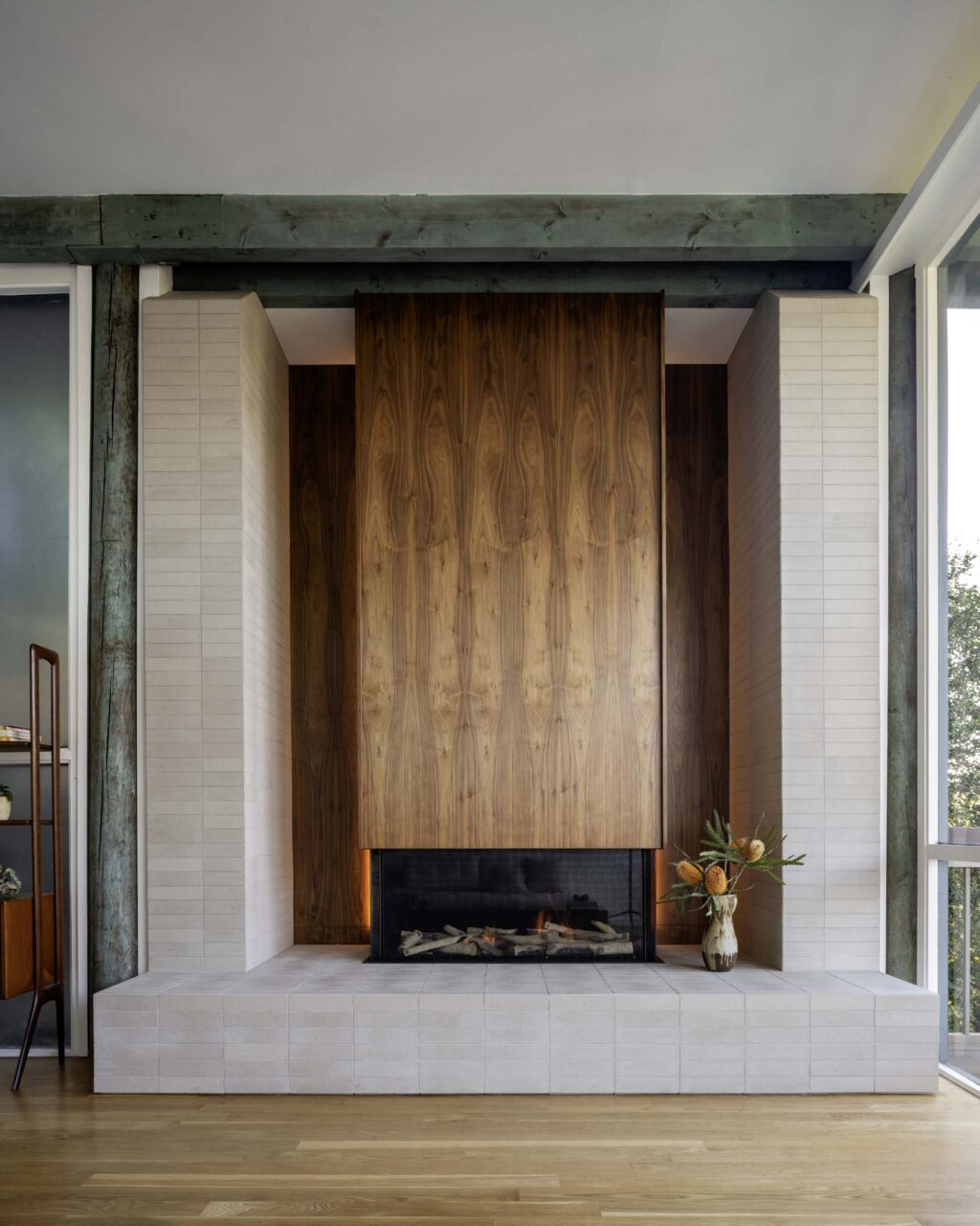 A wood fireplace at the renovated Jennings Residence
