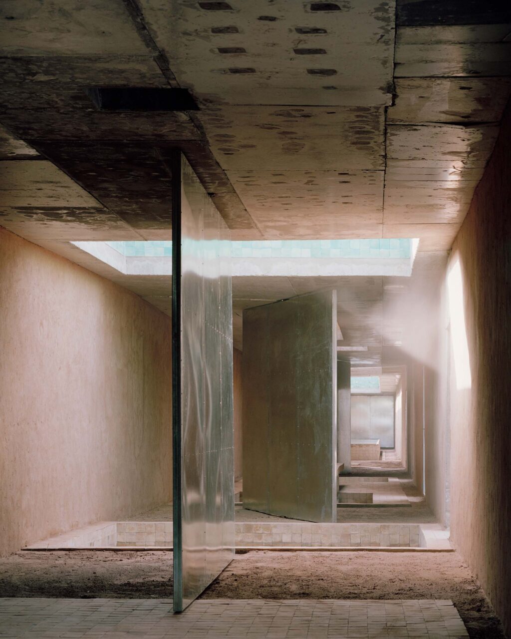 Large pivot doors separate Dar El Farina