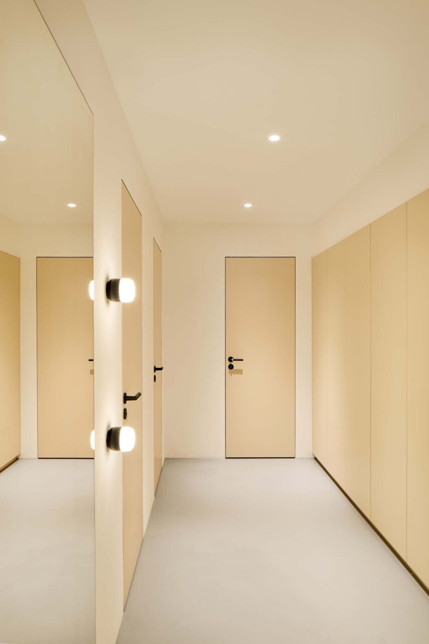 A pale yellow office bathroom designed by Studio Alexander Fehre
