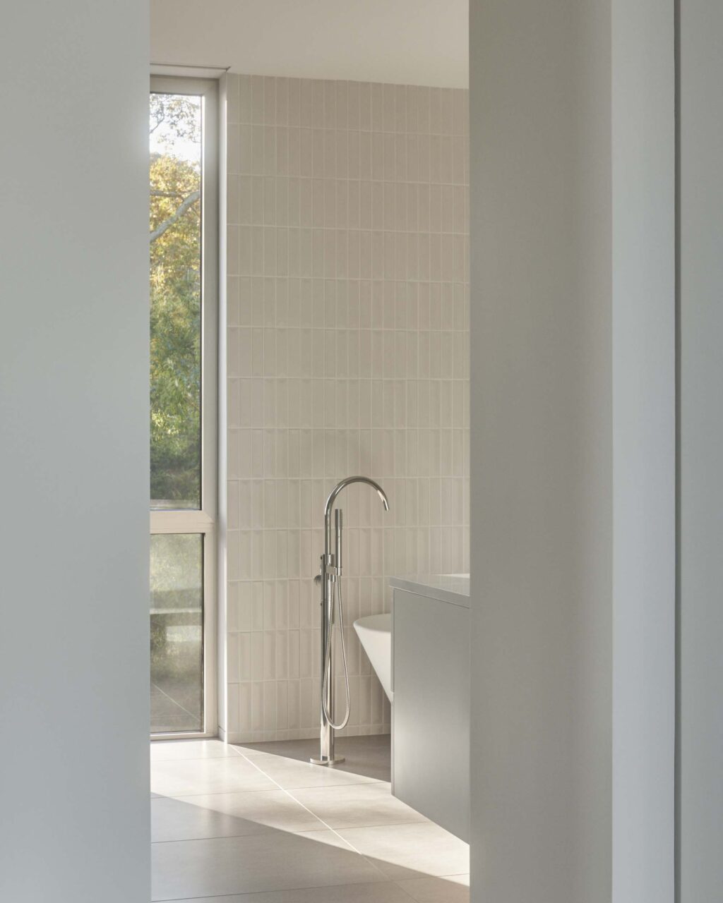 Desai Chia design a white-tiled bathroom