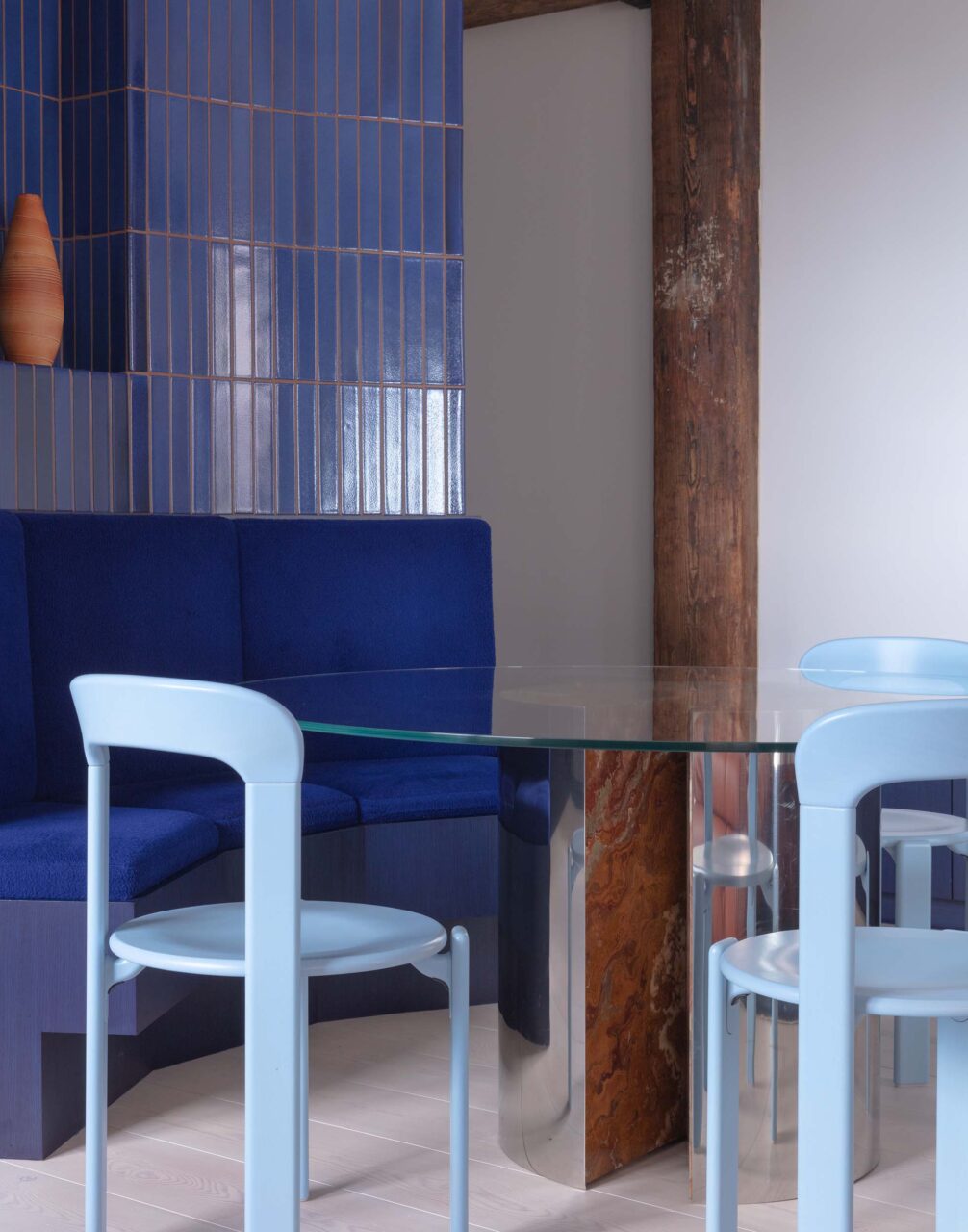 Blue tiles and fabric wrap a banquette from O-N