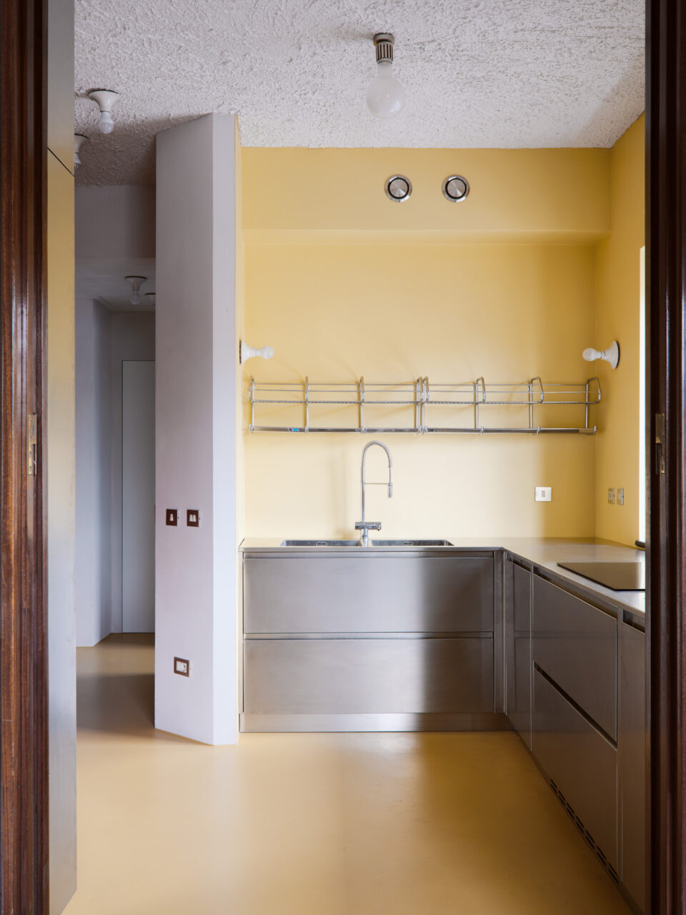 Yellow kitchen with stainless steel in self modern