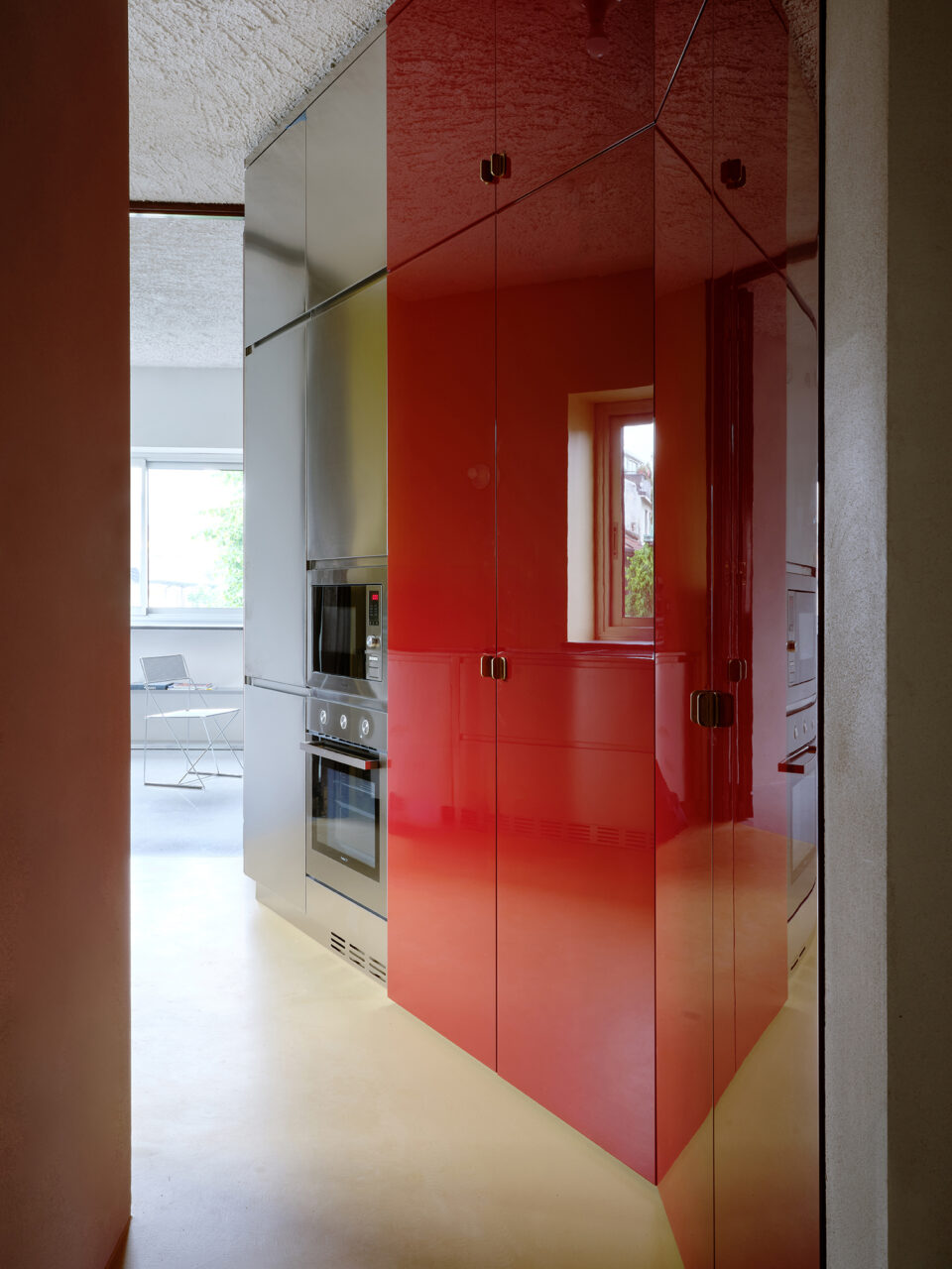red wardrobe in yellow kitchen